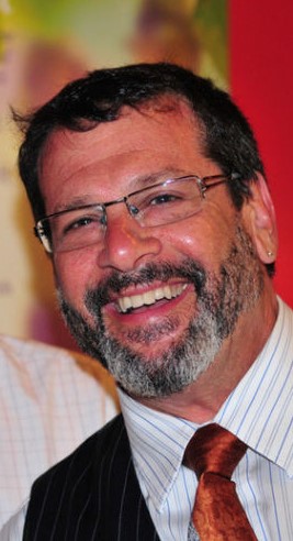 Drew Pulver smiling at a theater community event.