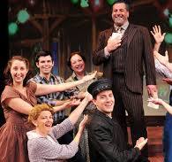 Drew Pulver performing on stage with the cast of The Most Happy Fella.